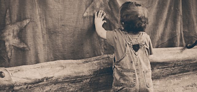 A boy leaning on the Wall A boy leaning on the Wall